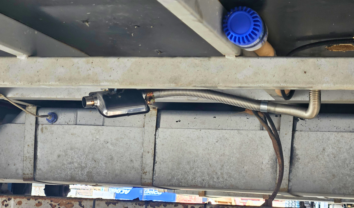 The heater exhaust is located under the vehicle to vent the fumes.